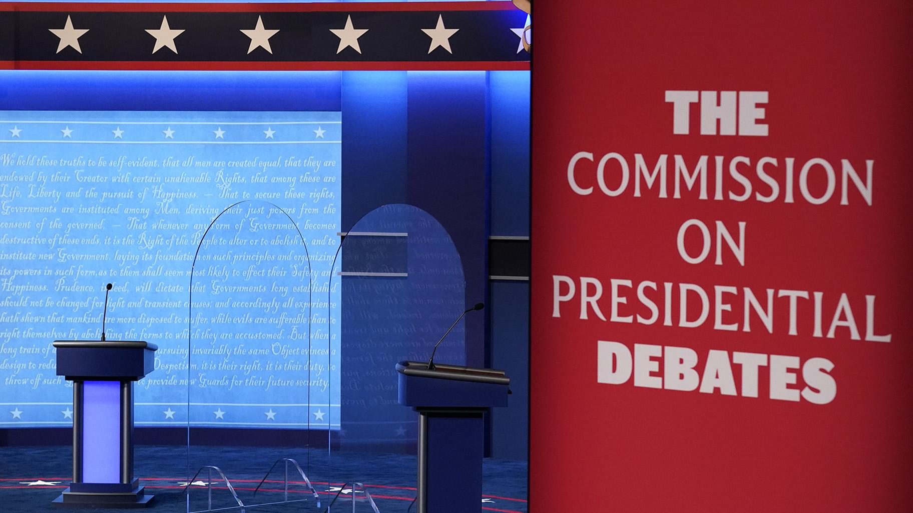 Clear protective panels stand onstage between lecterns as preparations take place for the second Presidential debate at Belmont University, Oct. 21, 2020, in Nashville, Tenn. (AP Photo / Patrick Semansky, File)
