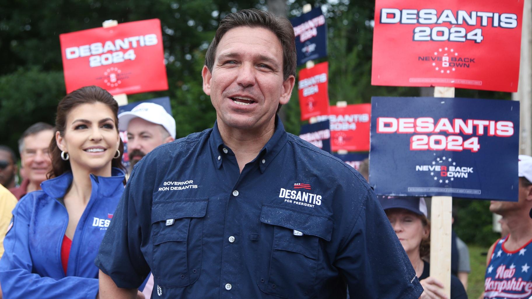 Republican presidential candidate and Florida Gov. Ron DeSantis and his wife Casey, walk in the July 4th parade, July 4, 2023, in Merrimack, N.H. (AP Photo / Reba Saldanha, File)