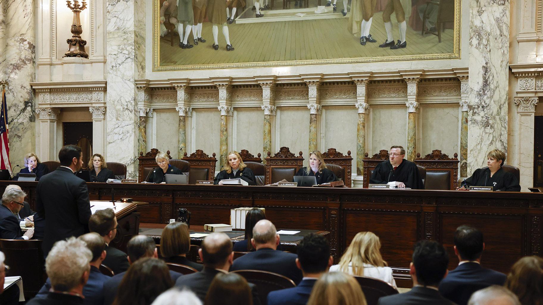 The Wisconsin Supreme Court listens to arguments from Wisconsin Assistant Attorney General Anthony D. Russomanno, representing Gov. Tony Evers, during a redistricting hearing at the state Capitol, Nov. 21, 2023, in Madison, Wis. (Ruthie Hauge / The Capital Times via AP, Pool, File)