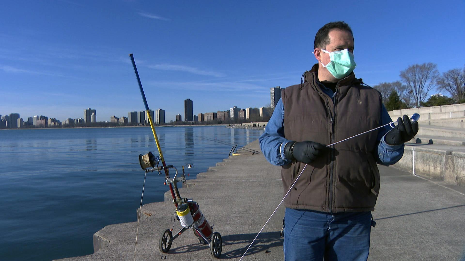 Florin Deleanu powerline fishes at Montrose Harbor in Chicago. (WTTW News)