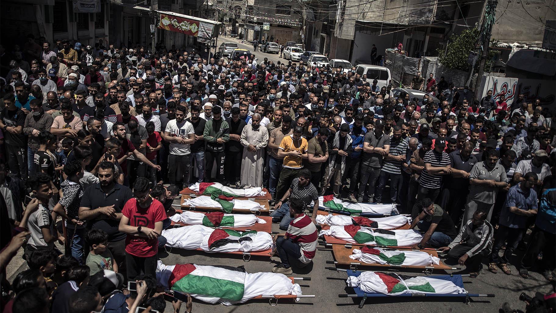 Palestinians attend the funeral of two women and eight children of the Abu Hatab family in Gaza City, who were killed after an Israeli air strike, Saturday, May 15, 2021. (AP Photo / Khalil Hamra)