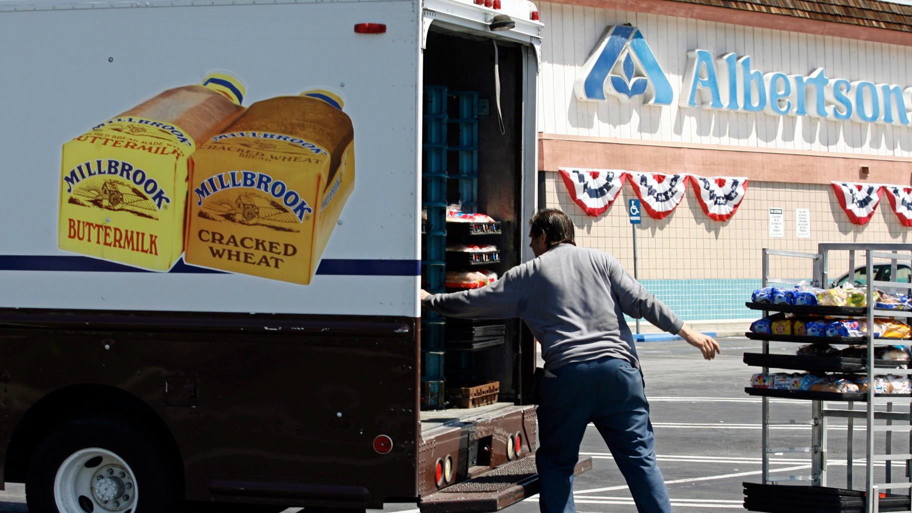 Mitch Maddox, a bread route salesman, loads bread Tuesday, May 30, 2006, outside the Eagle Rock Albertsons store in Los Angeles. (AP Photo / Damian Dovarganes, File)