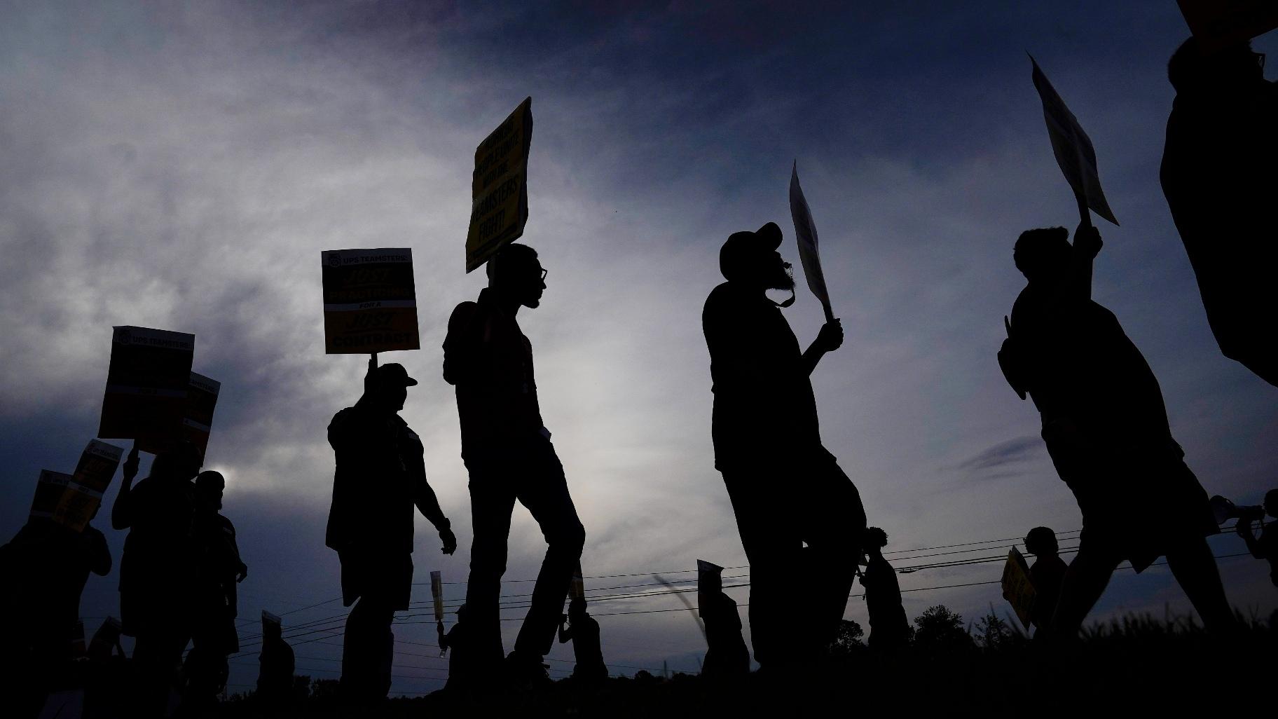 UPS teamsters and workers hold a rally, Friday, July 21, 2023, in Atlanta, as a national strike deadline nears. (AP Photo/Brynn Anderson, File)