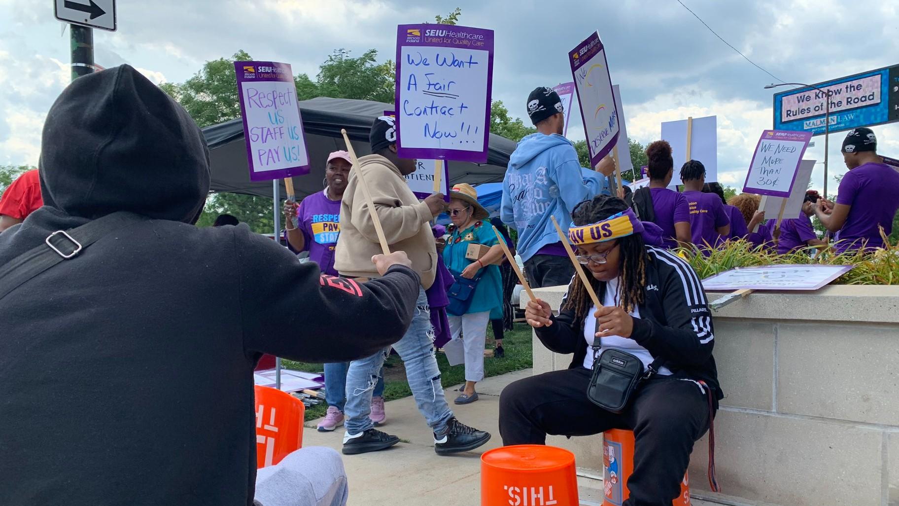 Loretto Hospital workers and other union supporters picket in front of the hospital’s emergency wing in Austin during the first day of the strike on July 31, 2023. (Eunice Alpasan / WTTW News)