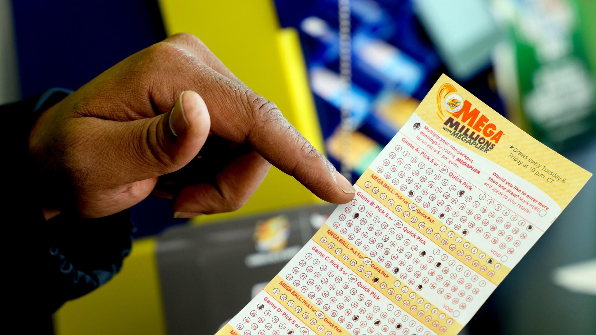 A Mega Millions lottery slip is displayed at Lucky Mart in Chicago on Tuesday, Jan. 10, 2023. (AP Photo / Teresa Crawford)