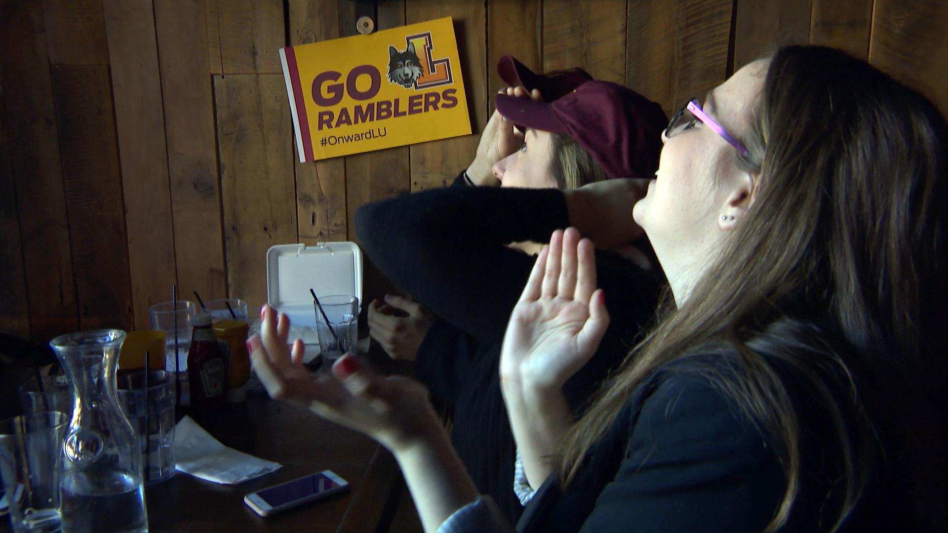 Loyola Ramblers fans cheer on the team at in Rogers Park bar Bruno’s on Thursday, March 15, 2018. (WTTW News)