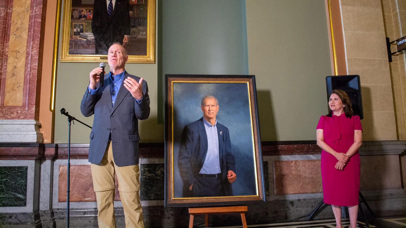 Former Gov. Bruce Rauner, now a Florida resident, unveils his official portrait before it is hung on the wall of the Illinois State Capitol on June 12, 2023. (Jerry Nowicki / Capitol News Illinois)
