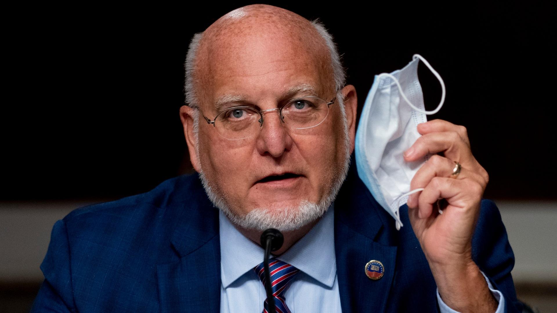 Centers for Disease Control and Prevention Director Dr. Robert Redfield holds up his mask as he speaks at a Senate Appropriations subcommittee hearing on a “Review of Coronavirus Response Efforts” on Capitol Hill, Wednesday, Sept. 16, 2020, in Washington. (AP Photo / Andrew Harnik, Pool)