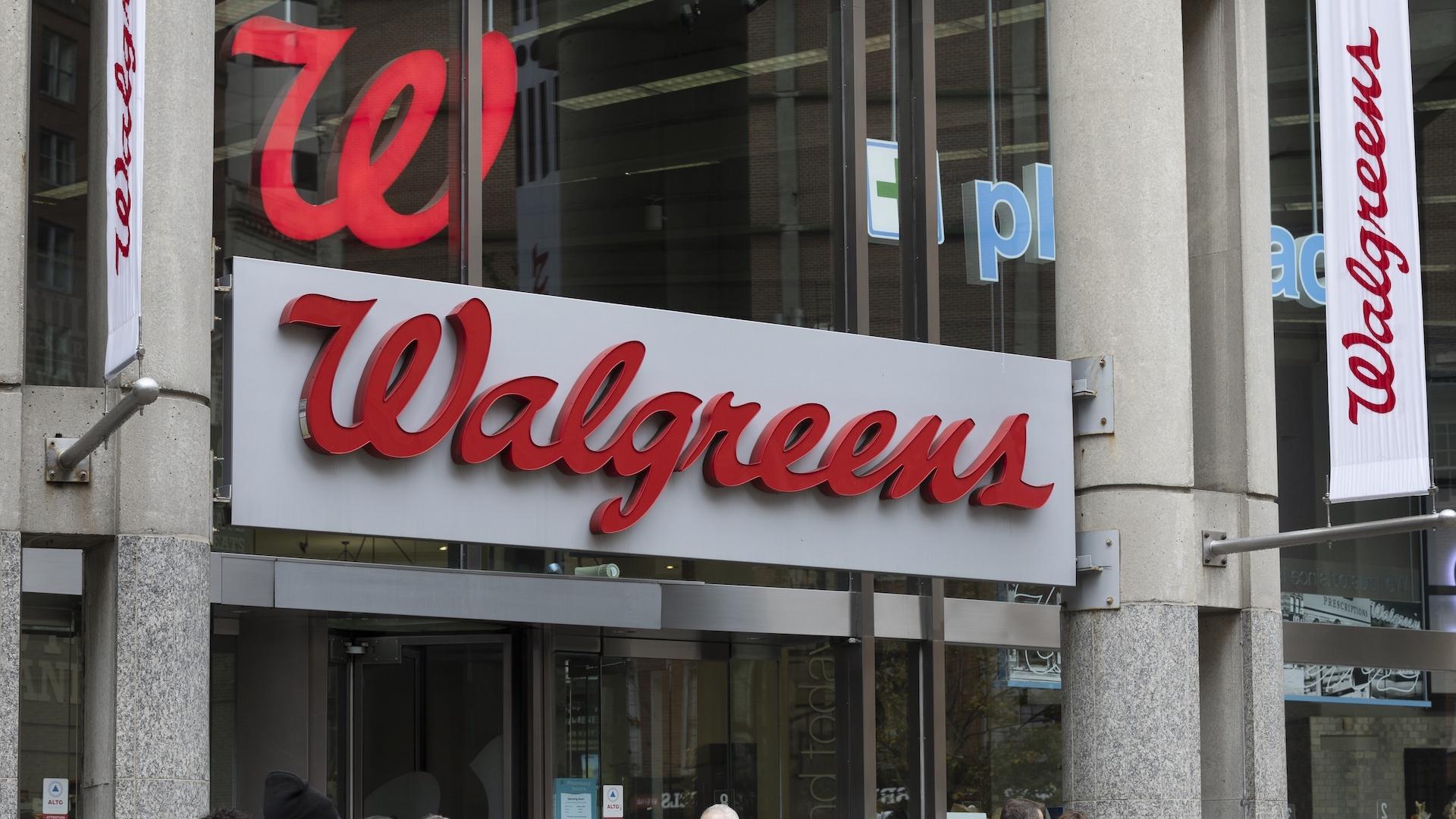 The entrance to a Walgreens is seen on Oct. 14, 2022, in Boston. Walgreens dove deeper into the health care sector on Monday, Nov. 7, when its VillageMD unit announced it would acquire another primary and urgent care provider, Summit Health-CityMD, in a deal worth close to $9 billion. (AP Photo/Michael Dwyer, File)