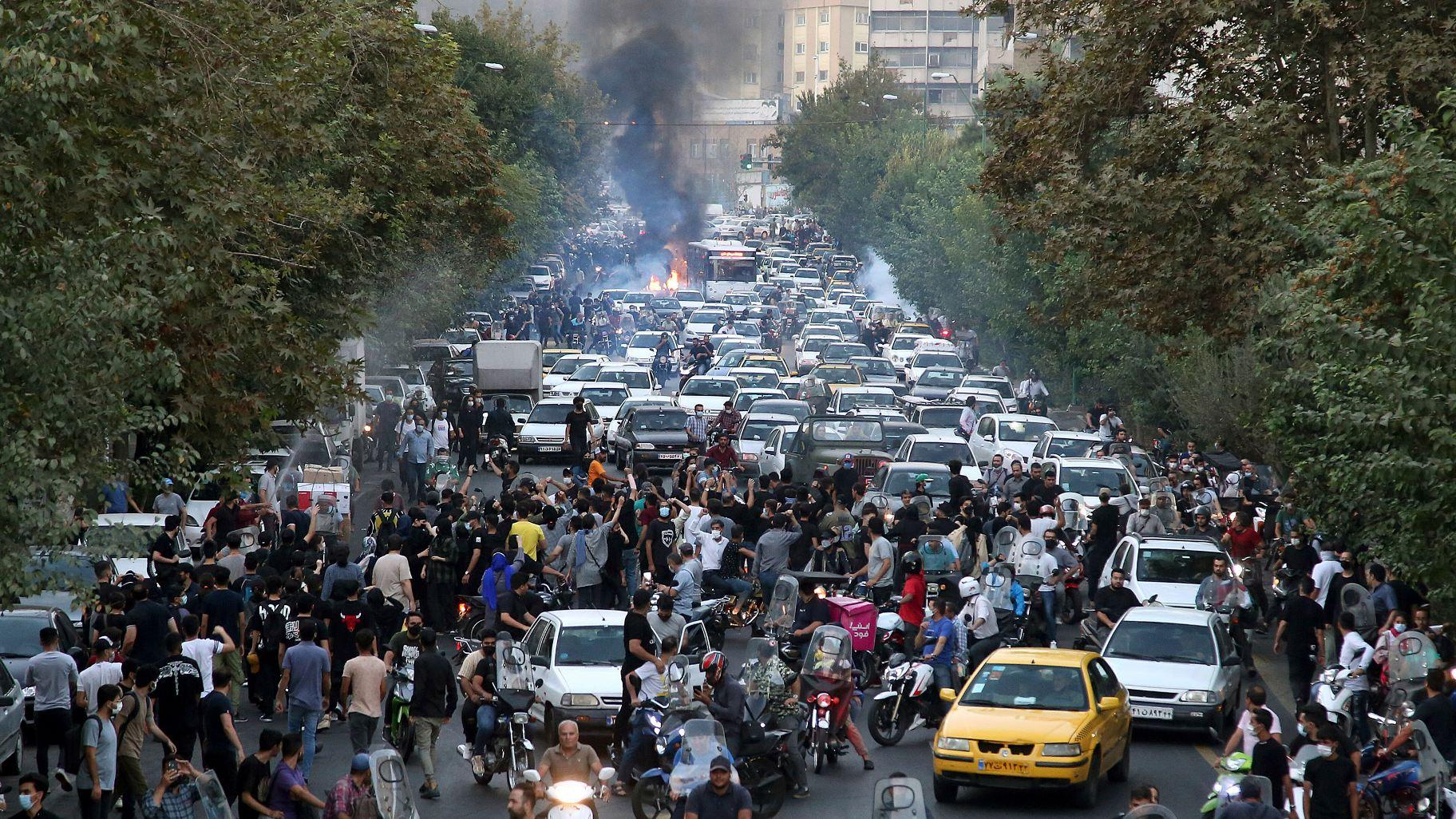Protesters chant slogans during a protest over the death of a woman who was detained by the morality police, in downtown Tehran, Iran, on Sept. 21, 2022. (Associated Press)