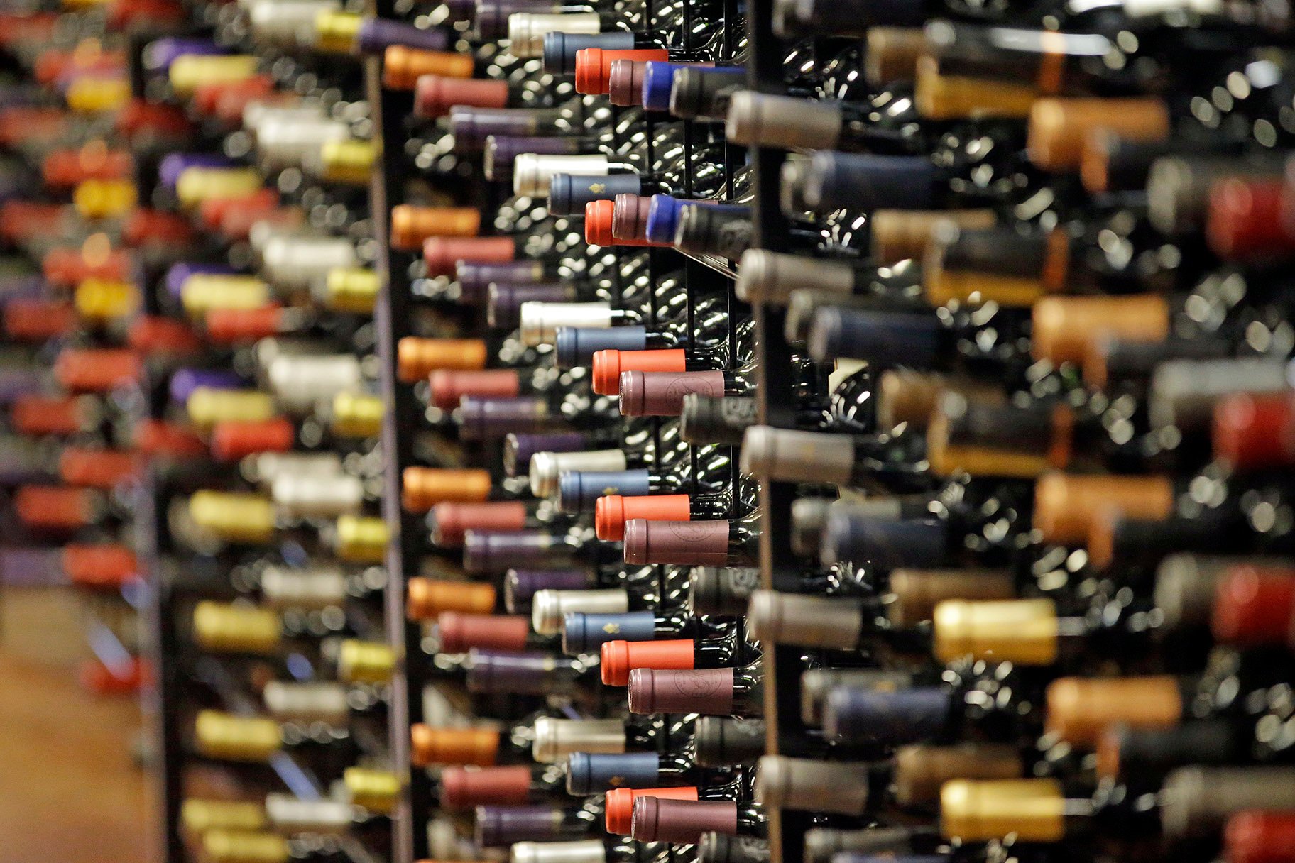 In this June 16, 2016, file photo, bottles of wine are displayed during a tour of a state liquor store, in Salt Lake City. According to federal health statistics, Americans are drinking more now than when Prohibition was enacted a century earlier. (AP Photo / Rick Bowmer, File)