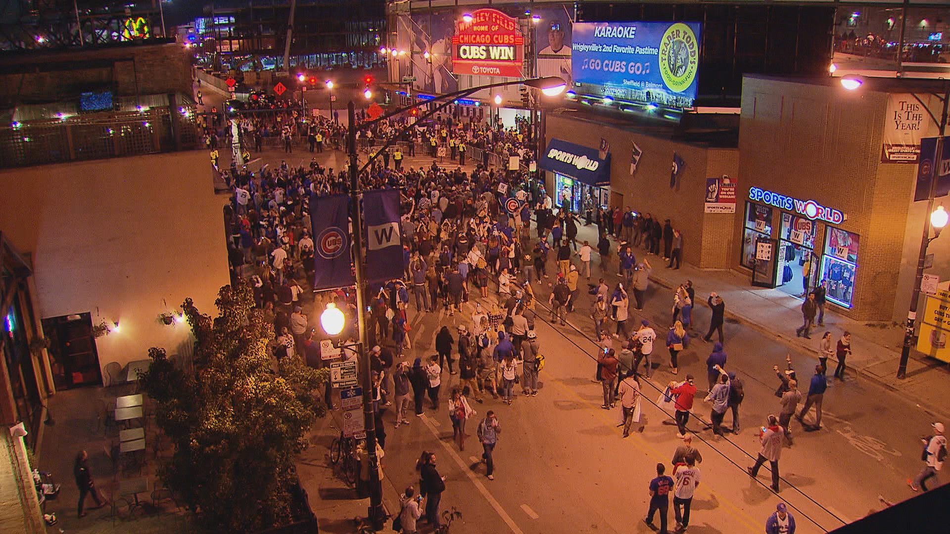 Cubs fans pour into the streets near the intersection of Addison and Clark streets last October following the team's NLDS-clinching win over the Cardinals.