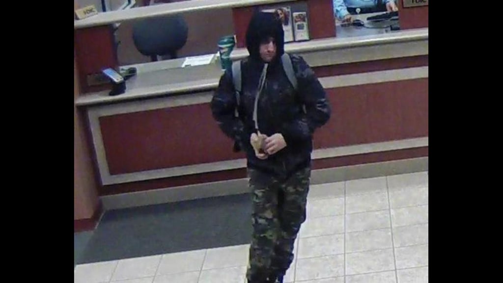 Surveillance footage shows the suspect in three Chicago bank robberies. Authorities believe that man is Matthew Silberman. (FBI)