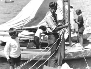<em>The Daily Boston Globe</em>’s photo caption: “Bob advises his brother John how to bend the jib of the <em>Victura.</em>” Photo courtesy of John F Kennedy Library, July 1934.