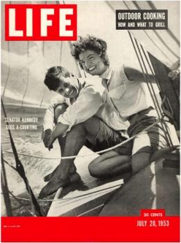 Jack and Jackie, newly engaged, on the bow of <em>Victura</em> and on the cover of <em>Life</em> magazine. Photo courtesy of Hy Peskin’s SL & WH, issue dated July 20, 1953.