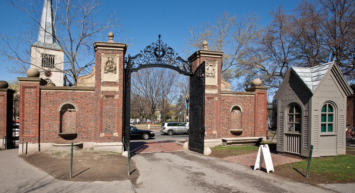 The array of wrought iron atop Johnston Gate includes a wreath-adorned cross that symbolizes Harvard’s early commitment to training ministers as well as numerals denoting the year of the university’s founding, 1636. Above “1636”is a small shield displaying the year of the gate’s completion, 1889. (Credit: Ralph Lieberman)