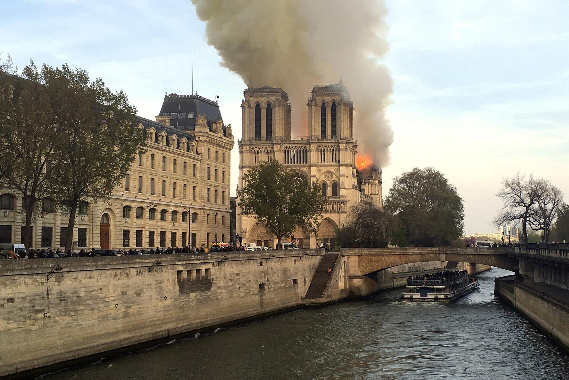 Notre Dame Cathedral is burning in Paris on Monday, April 15, 2019. (AP Photo / Lori Hinant)