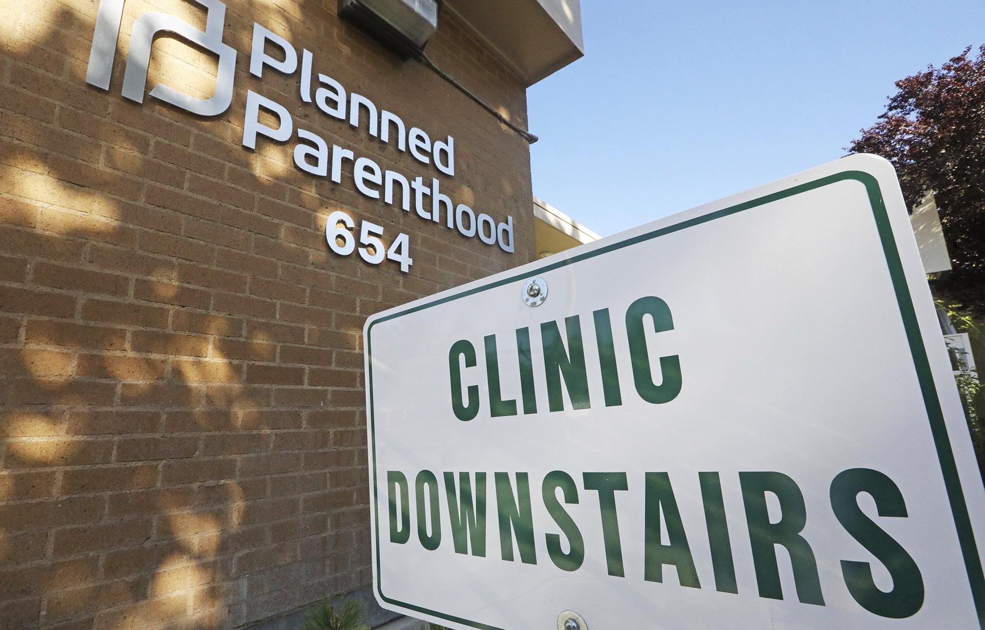 A sign is displayed at Planned Parenthood of Utah Wednesday, Aug. 21, 2019, in Salt Lake City. About 39,000 people received treatment from Planned Parenthood of Utah in 2018 under a federal family planning program called Title X. The organization this week announced it is pulling out of the program rather than abide by a new Trump administration rule prohibiting clinics from referring women for abortions. (AP Photo / Rick Bowmer)