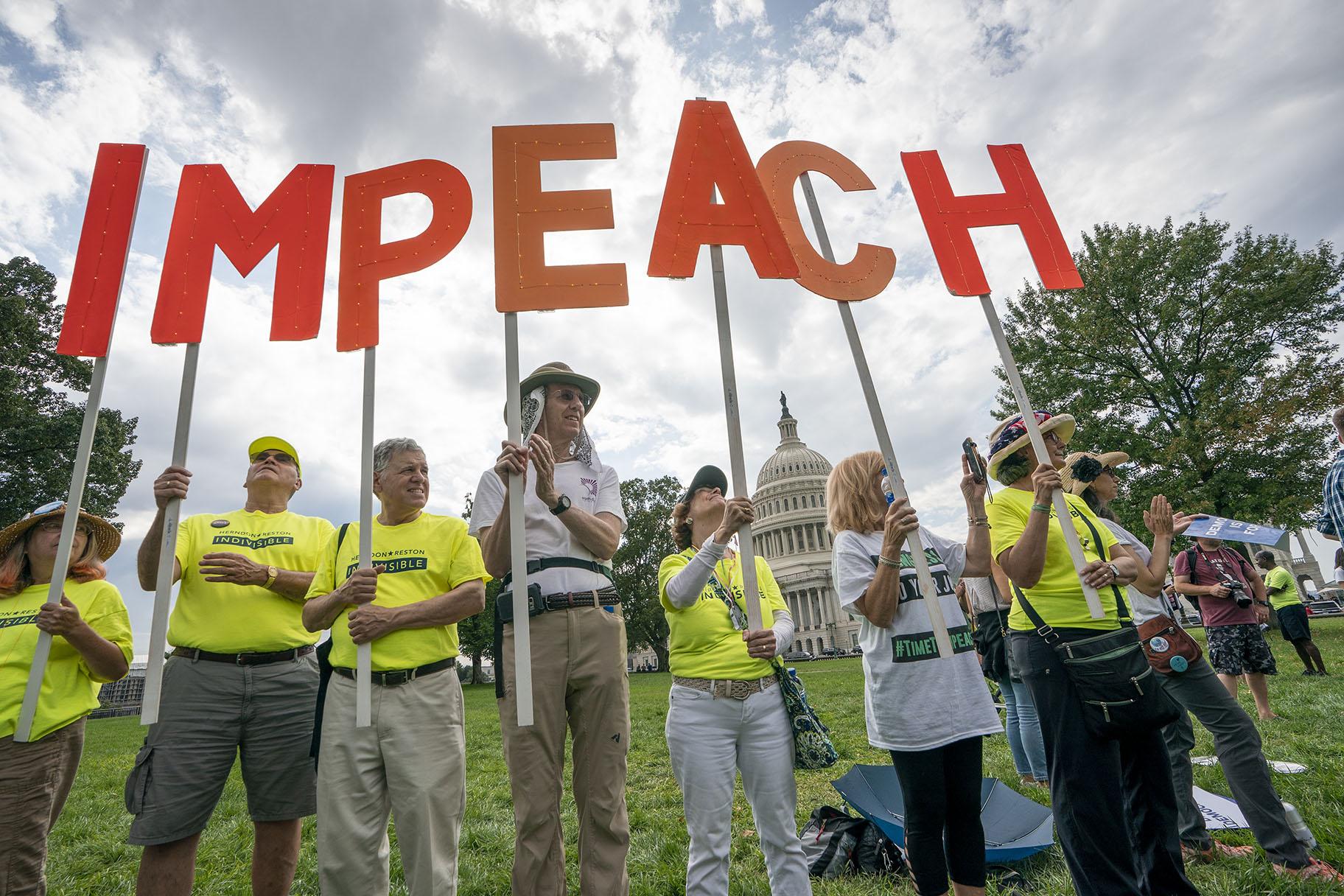 Activists rally for the impeachment of President Donald Trump at the Capitol in Washington on Thursday, Sept. 26, 2019. (AP Photo / J. Scott Applewhite)