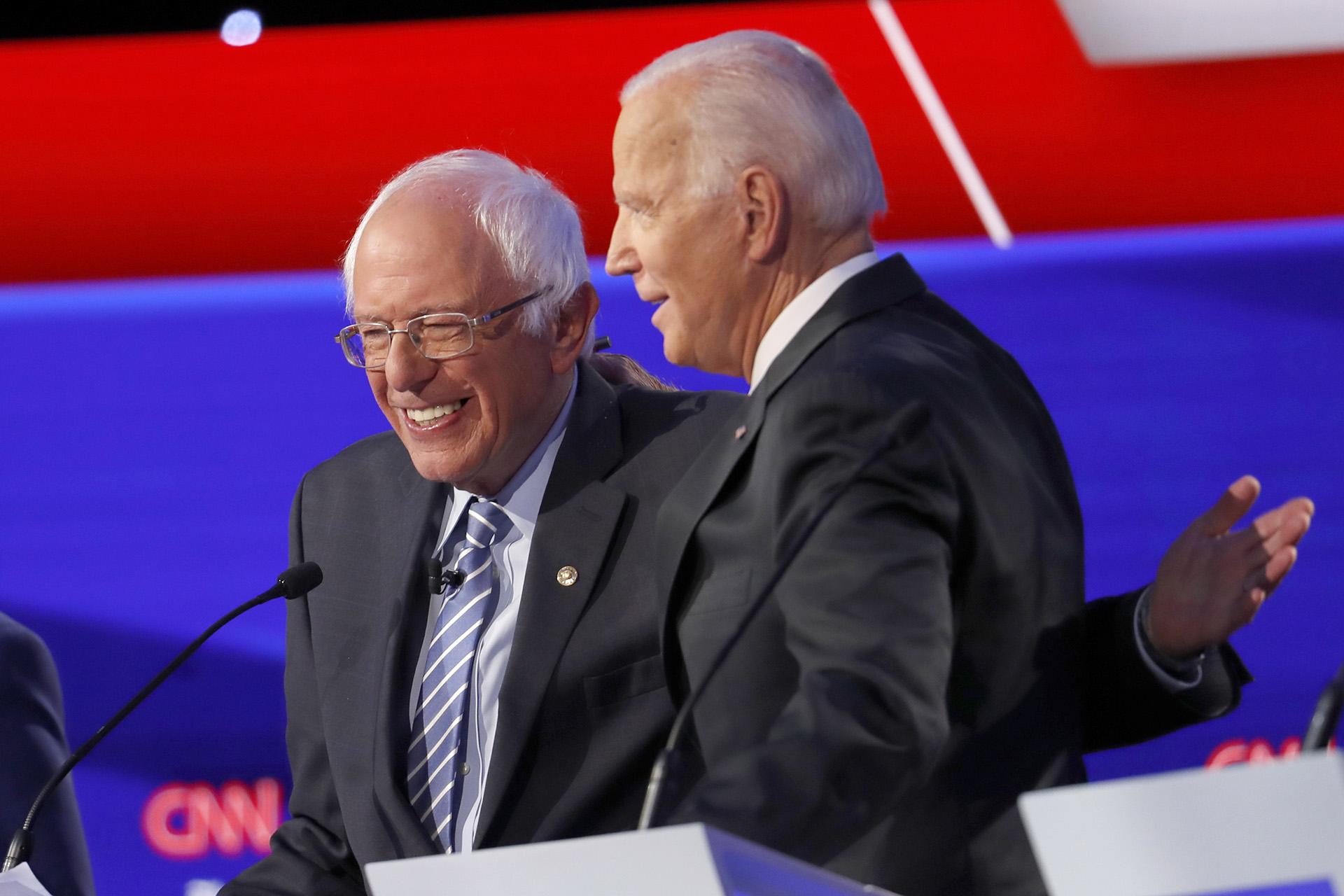 Democratic presidential candidate Sen. Bernie Sanders, I-Vt., left, and former Vice President Joe Biden hug during a Democratic presidential primary debate hosted by CNN/New York Times at Otterbein University, Tuesday, Oct. 15, 2019, in Westerville, Ohio. (AP Photo / John Minchillo)