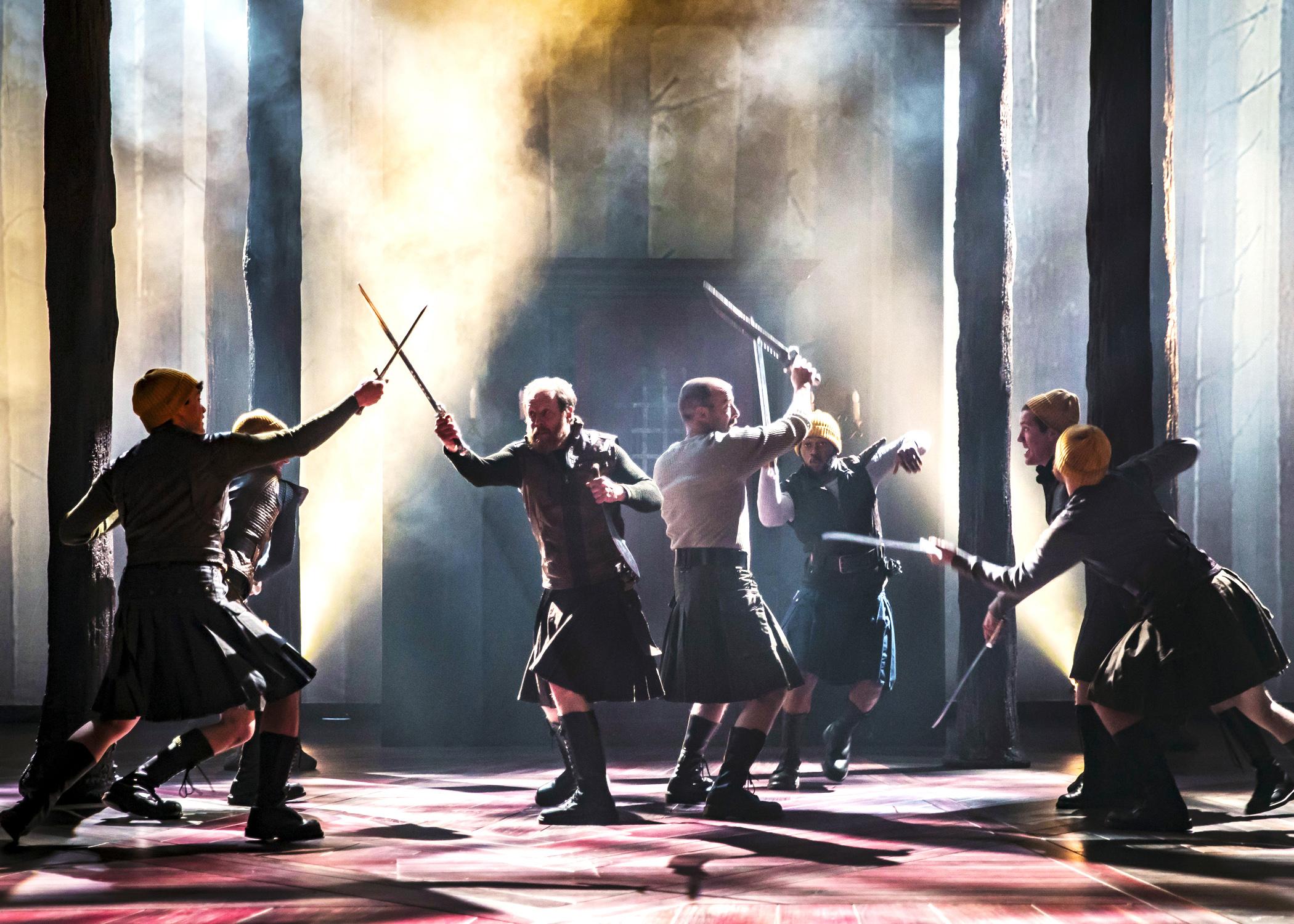 Macbeth (Ian Merrill Peakes, right center) and Banquo (Andrew White, left center) engage in the battle for Scotland in “Macbeth.” (Photo by Liz Lauren)
