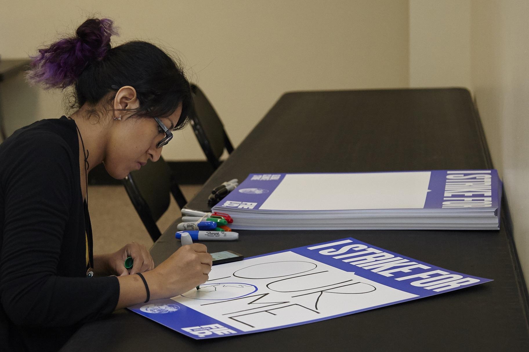 Field Museum staff have been making posters in preparation for the youth-led climate strike on Friday, Sept. 20, 2019. (Michelle Kuo / Field Museum) 