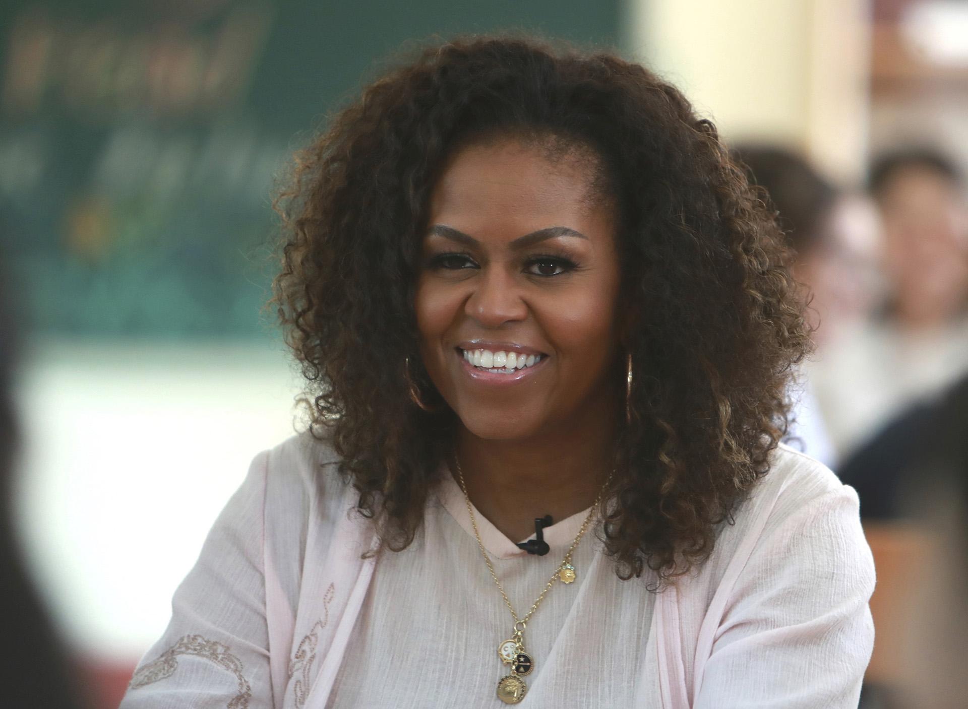 In this Dec. 9, 2019, file photo, former first lady Michelle Obama listens to female students at the Can Giuoc high school in Long An province, Vietnam.  (AP Photo / Hau Dinh, File)