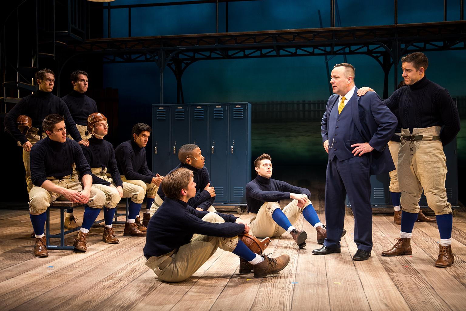 Knute Rockne (Stef Tovar) and George Gipp (Adrian Aguilar) give the Fighting Irish a pep talk. (Credit: Justin Barbin)