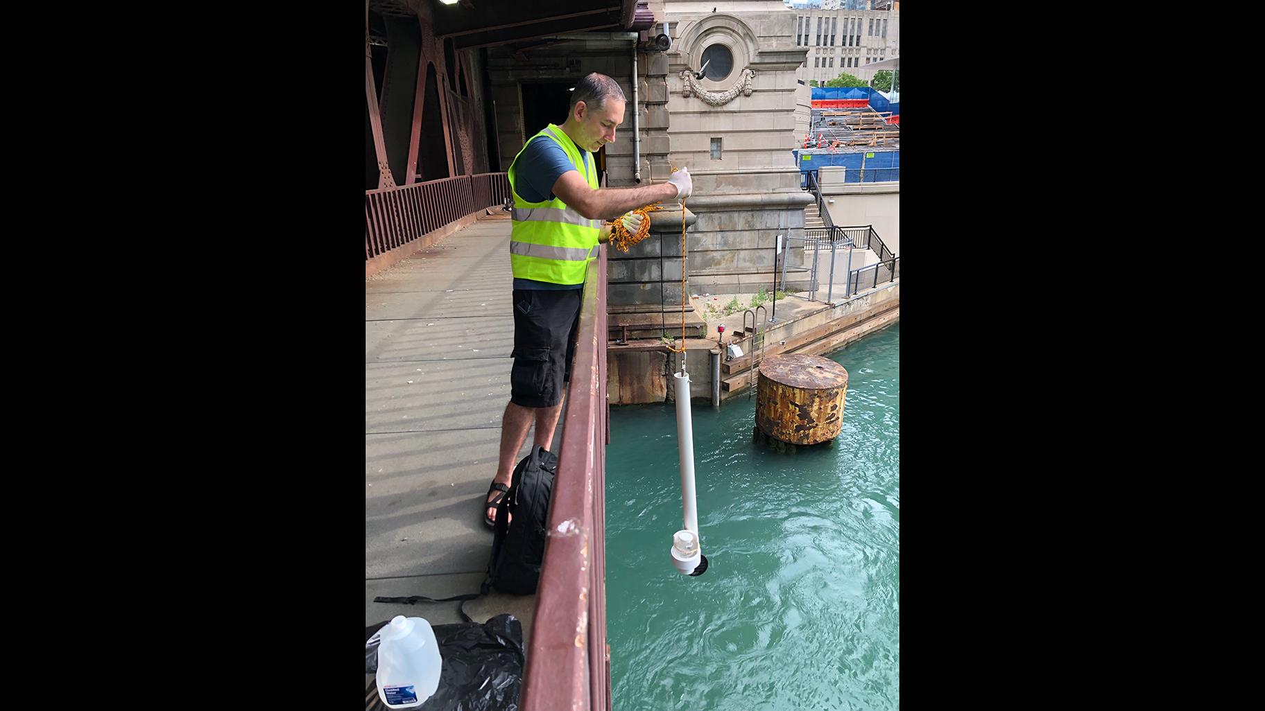 Steve Frenkel, Current’s executive director, conducts water sampling in the Chicago River. (Courtesy Current) 