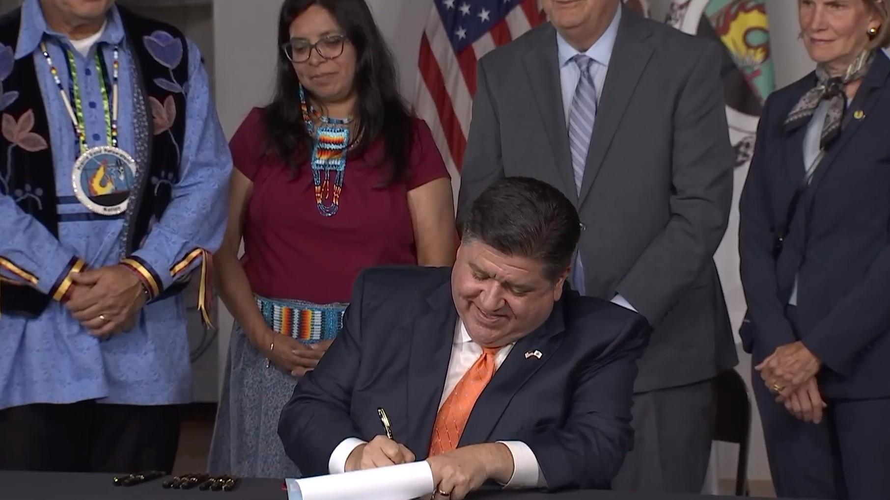 Gov. J.B. Pritzker signs bills establishing expanded protections for Native Americans in Illinois, including the Human Remains Protection Act (HB3413), on Aug. 4, 2023. (Governor JB Pritzker / Facebook)