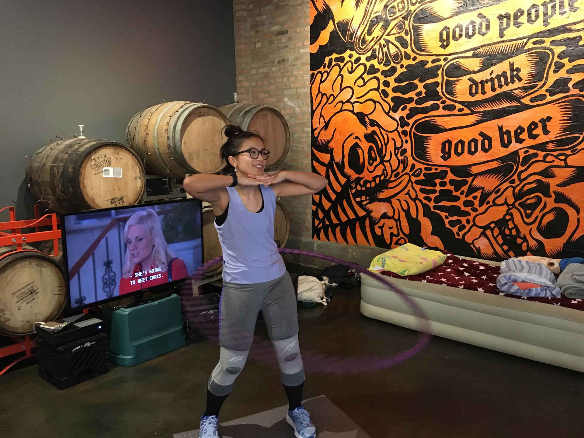 Wicker Park resident Jenny Doan poses for a picture Saturday, Nov. 23, 2019, as she nears the end of her Guinness World Record attempt for longest marathon hula-hooping session. (Kristen Thometz / WTTW News)