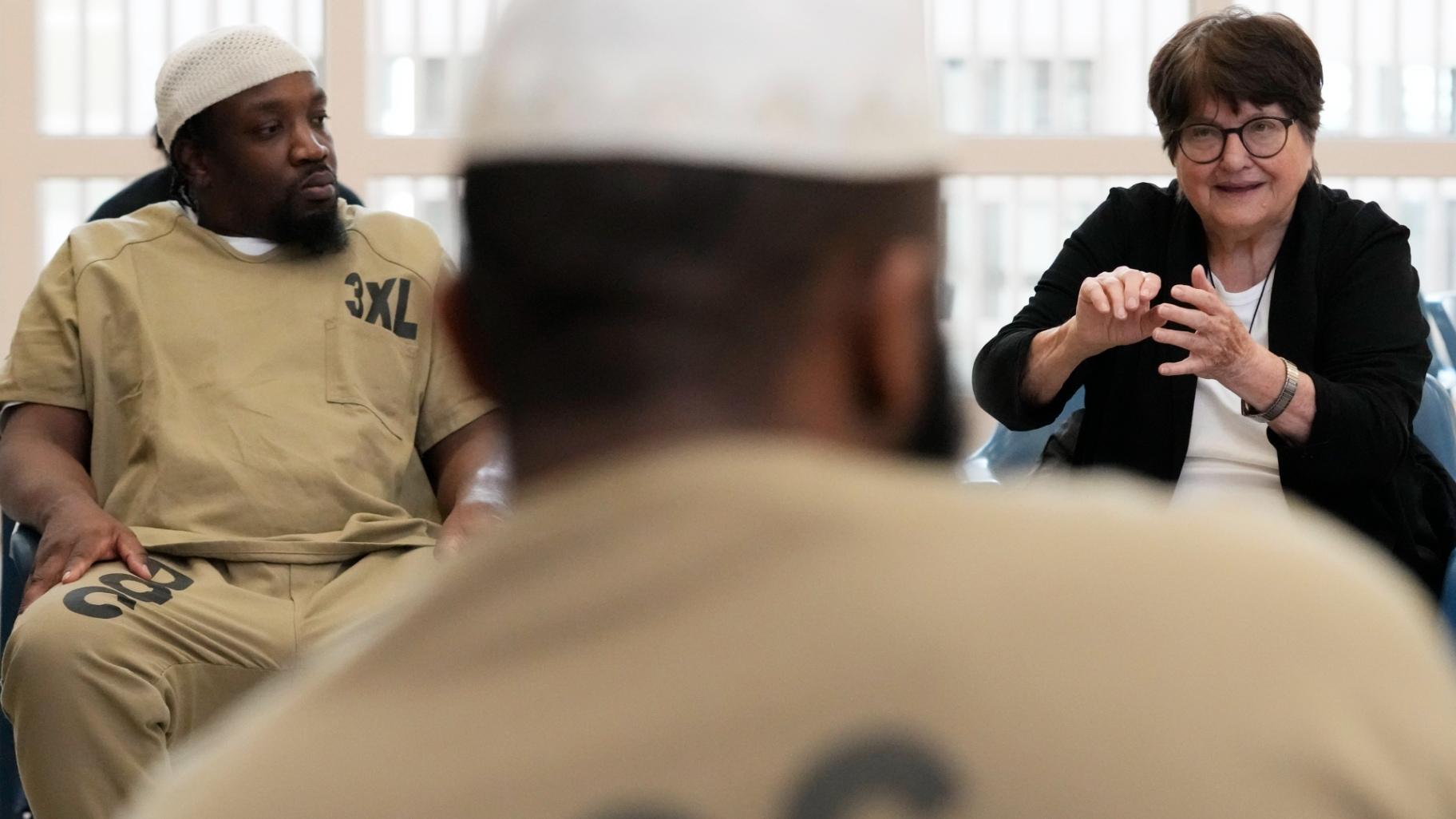 Sister Helen Prejean, right, talks as Richard Obot, left, detainee in Division Of Correction 11, listens to her during a book club at Department Of Corrections Division 11 in Chicago, Monday, April 22, 2024. (Nam Y. Huh / AP Photo)