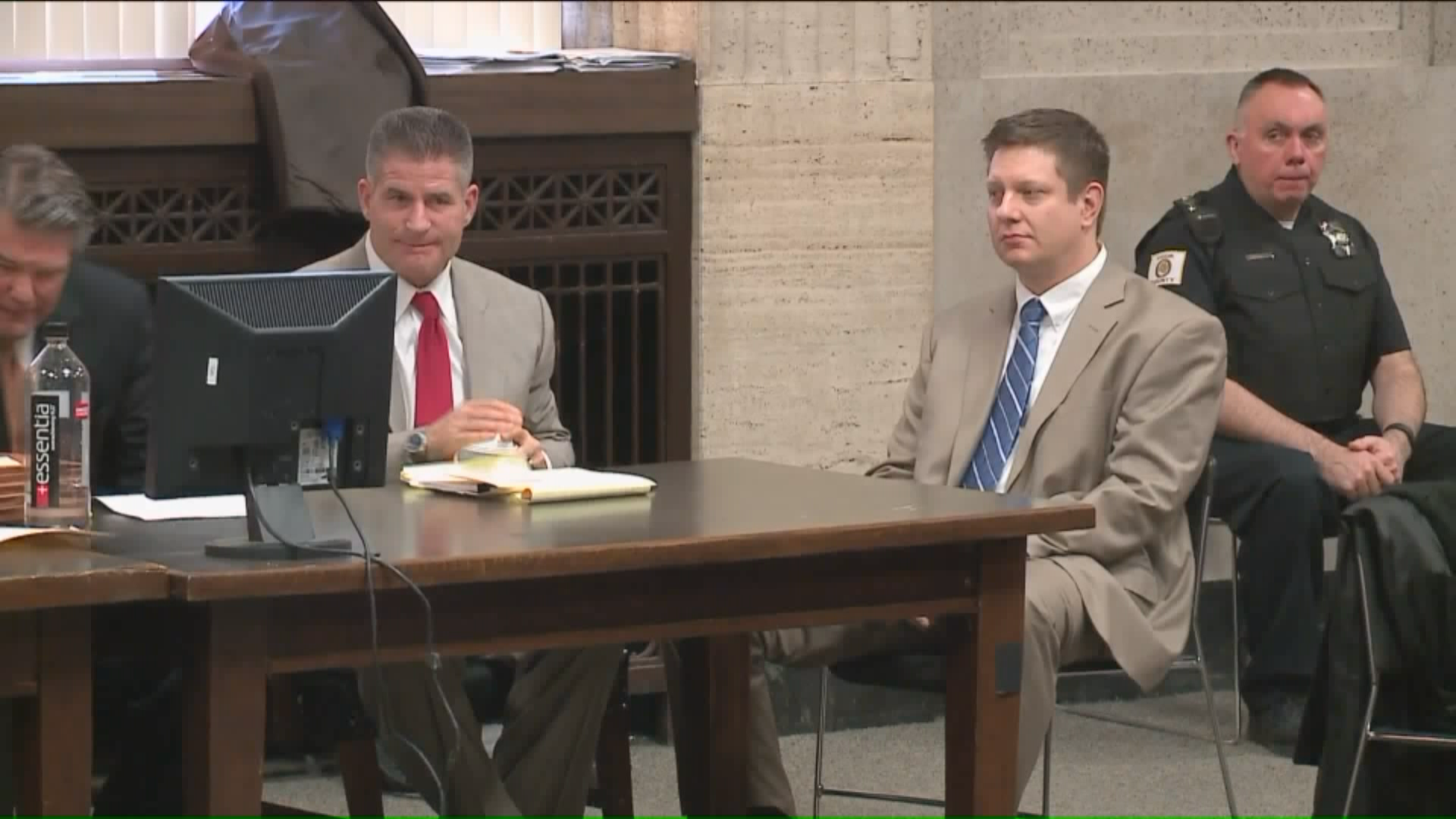 Former police officer Jason Van Dyke, right, is charged with murder in the shooting of Laquan McDonald. (Courtesy of WGN)