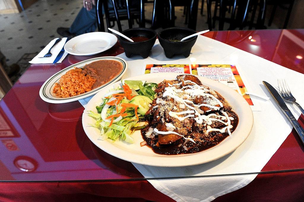 Chicken enchiladas with mole sauce is just one way the sauce is used in traditional Mexican cuisine. (Jazz Guy / Flickr)