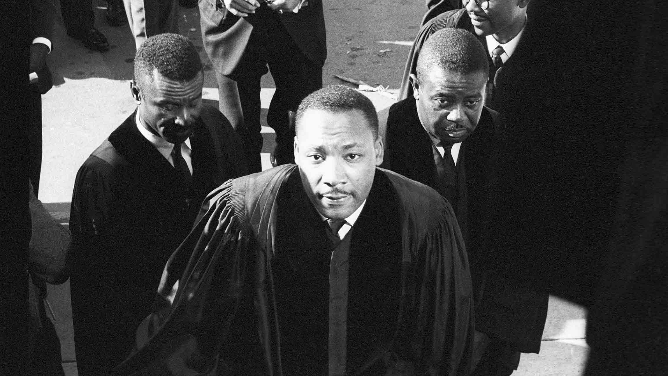 Civil Rights leaders Fred Shuttlesworth, left, Martin Luther King Jr., center, and Ralph Abernathy, right, attend a funeral for victims of the 16th Street Church bombing in Birmingham, Alabama. The Sept. 15, 1963 bombing killed four young African-American girls. (Chicago History Museum)