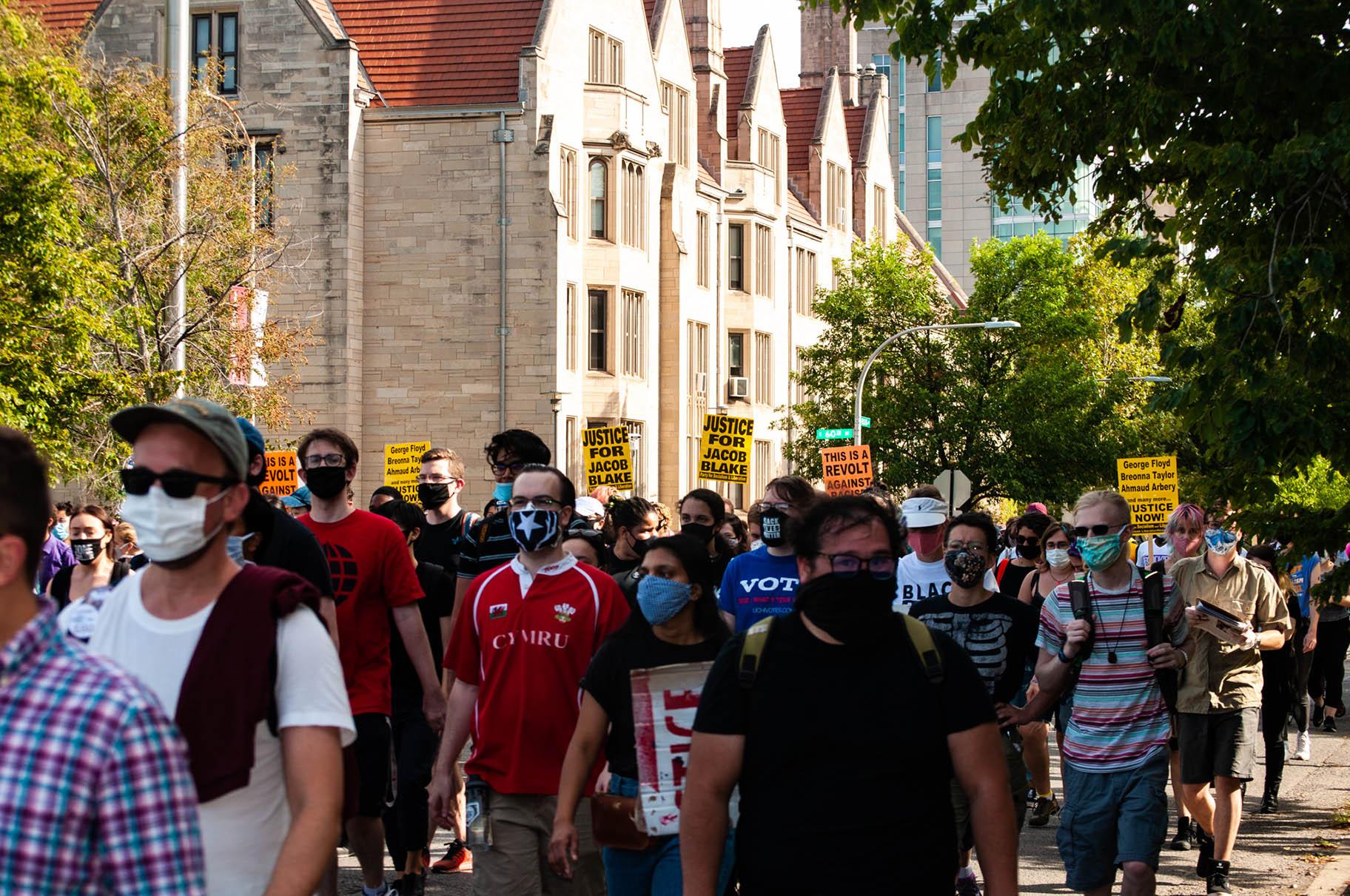 A march against the University of Chicago Police Department was organized by Care Not Cops and UChicago United on Saturday, Aug. 29, 2020. (Grace Del Vecchio / WTTW News)