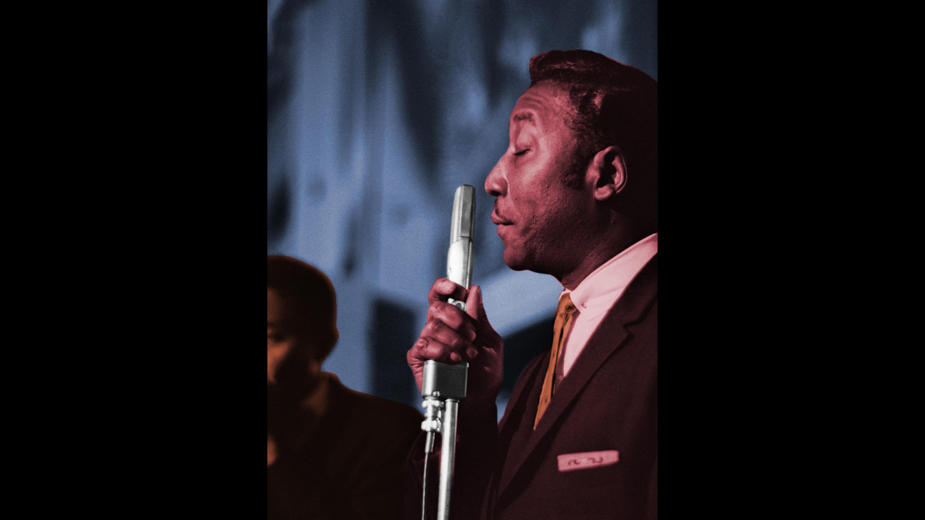 Muddy Waters performing at Pepper’s Lounge in Chicago, 43rd and Vincennes, 1961. Raeburn Flerlage image, colorized. (Chicago History Museum)