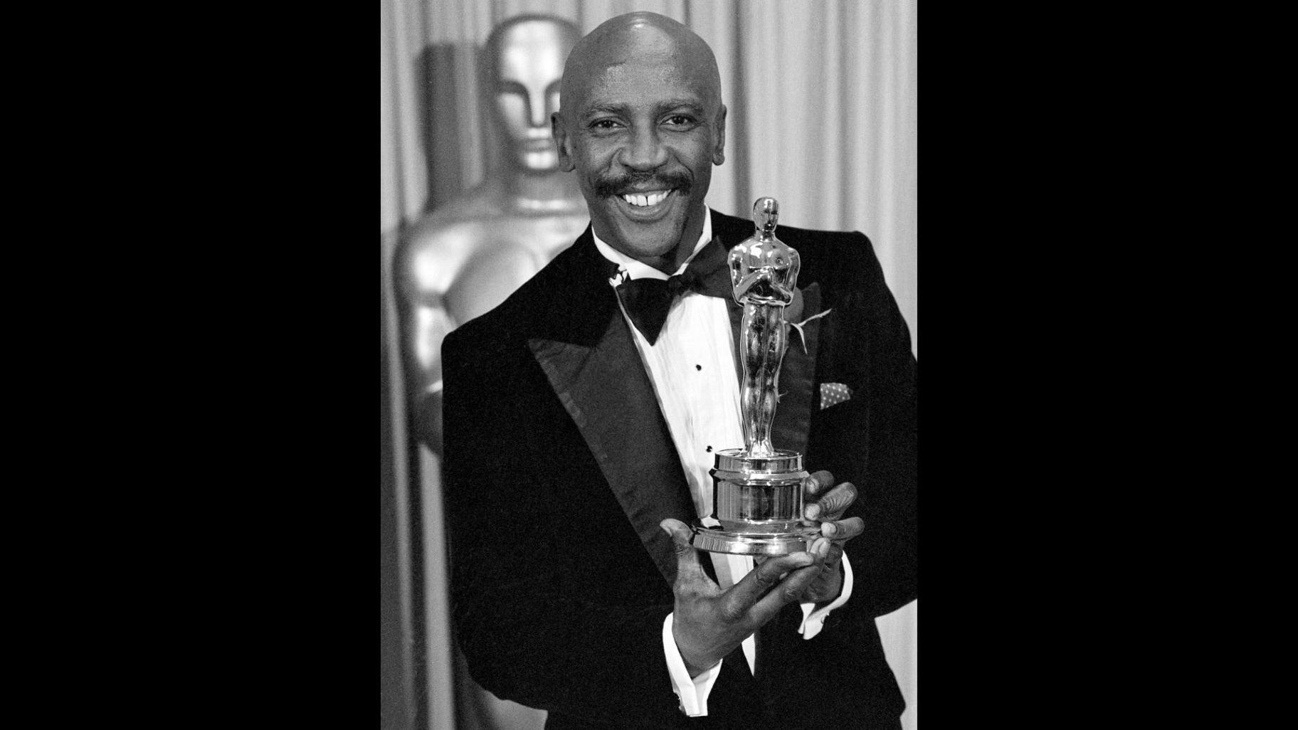 FILE - Louis Gossett Jr., poses with the Oscar for best supporting actor for his role in "An Officer and a Gentleman," at the annual Academy Awards presentation in Los Angeles on April 11, 1983. (AP Photo, File)