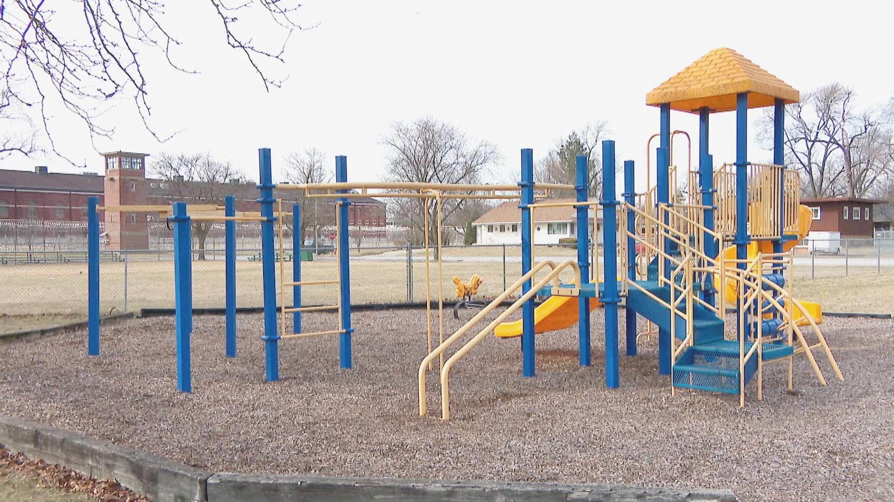 A park and playground in Pontiac, Illinois, sit outside the Pontiac Correctional Center’s fences. (WTTW News)