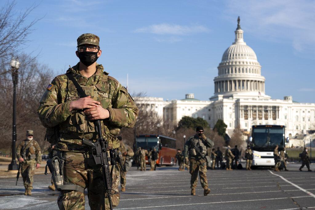 Members of the national guard patrol the area outside of the U.S. Capitol during the impeachment trial of former President Donald Trump at Capitol Hill in Washington, Tuesday, Feb. 9, 2021. (AP Photo / Jose Luis Magana)