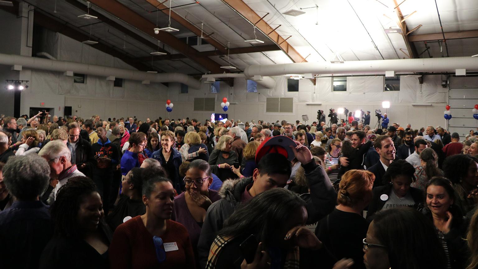 Supporters at Lauren Underwood’s election night headquarters. (Evan Garcia / Chicago Tonight)