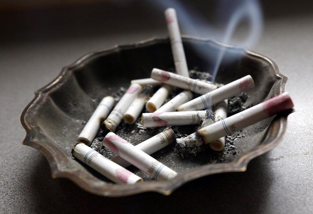 In this Saturday, March 2, 2013 file photo, a cigarette burns in an ashtray in Hayneville, Ala. (AP Photo / Dave Martin)