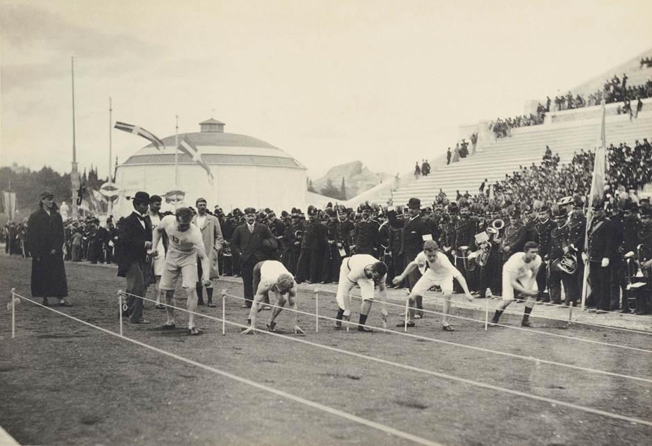 Thomas Burke, second from the left, crouches in his starting position for the 100 meter sprint at the 1896 Olympics. (Courtesy of The Benaki Museum)