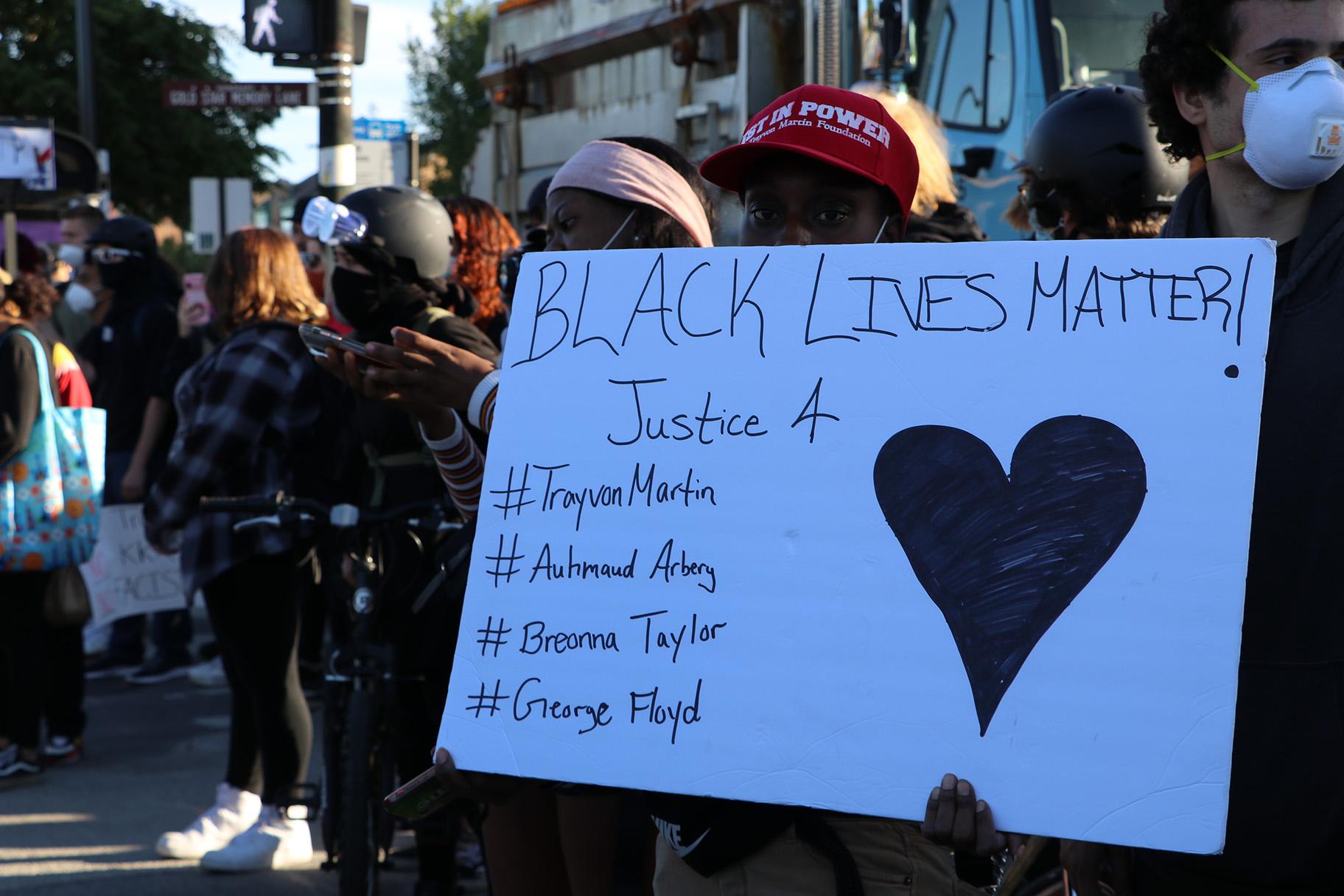 A protester holds a Black Lives Matter sign. (Evan Garcia / WTTW News)