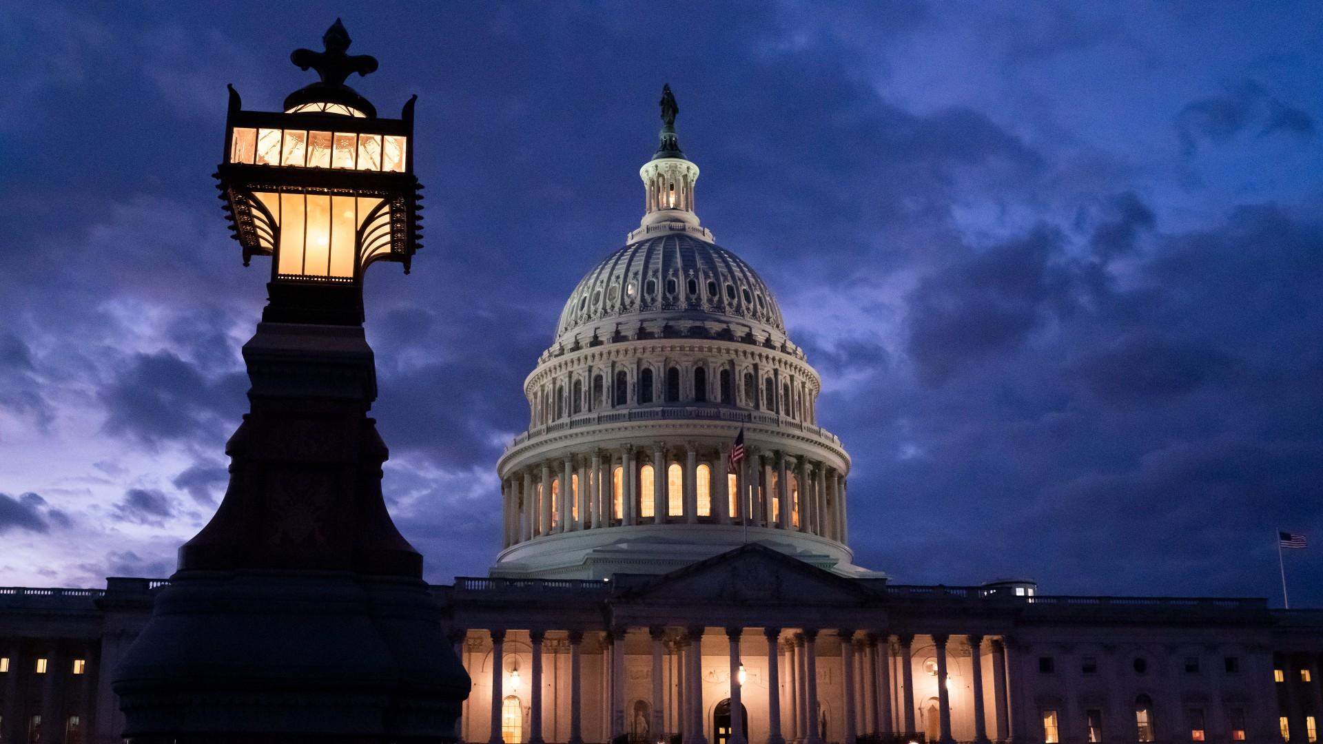 Night falls at the Capitol in Washington, Thursday, Dec. 2, 2021, with the deadline to fund the government approaching. (AP Photo / J. Scott Applewhite)