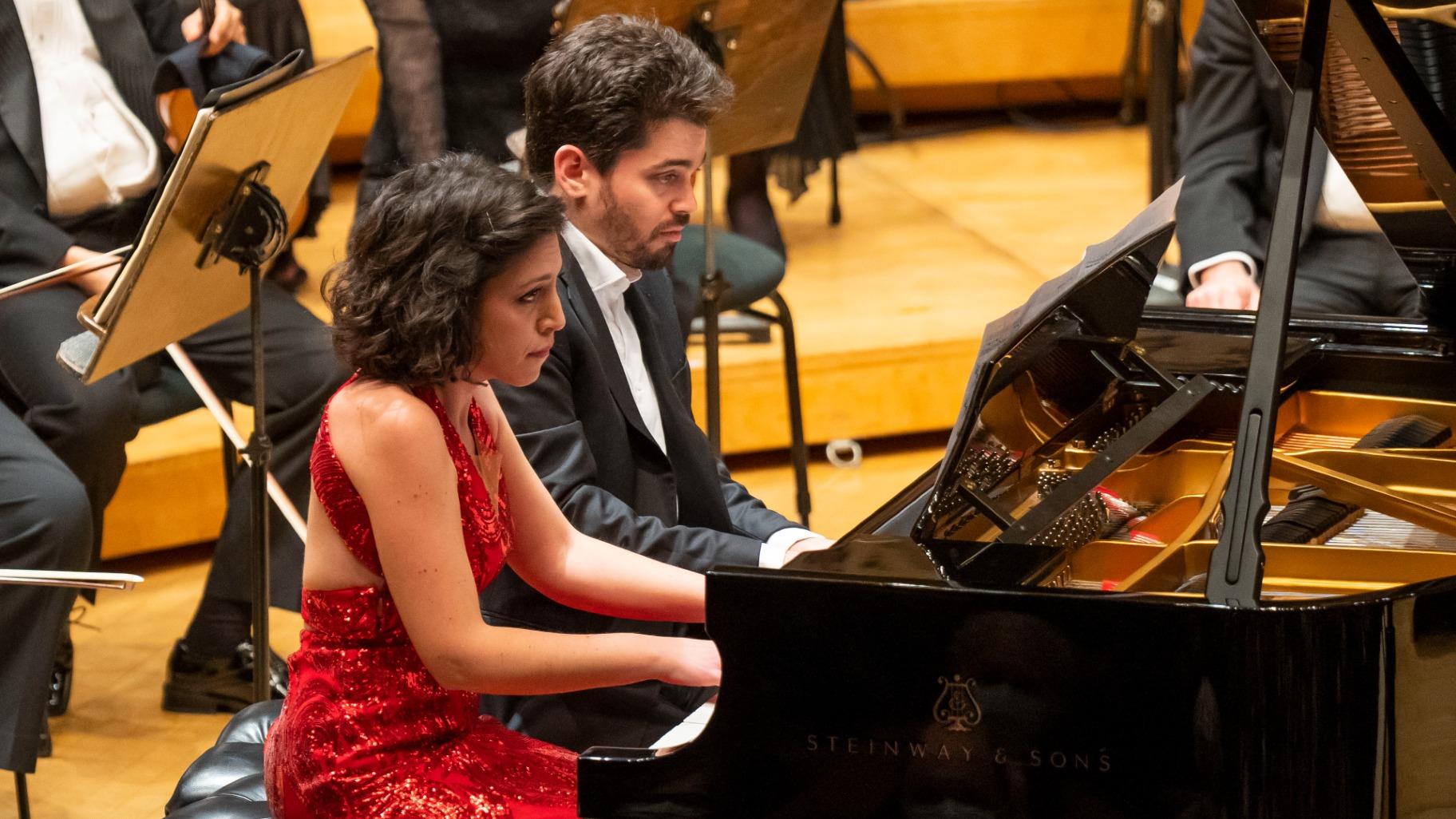 Conductor Lahav Shani and pianist Beatrice Rana perform an encore for piano four hands Rana’s CSO debut on Feb. 9, 2023. (Todd Rosenberg)