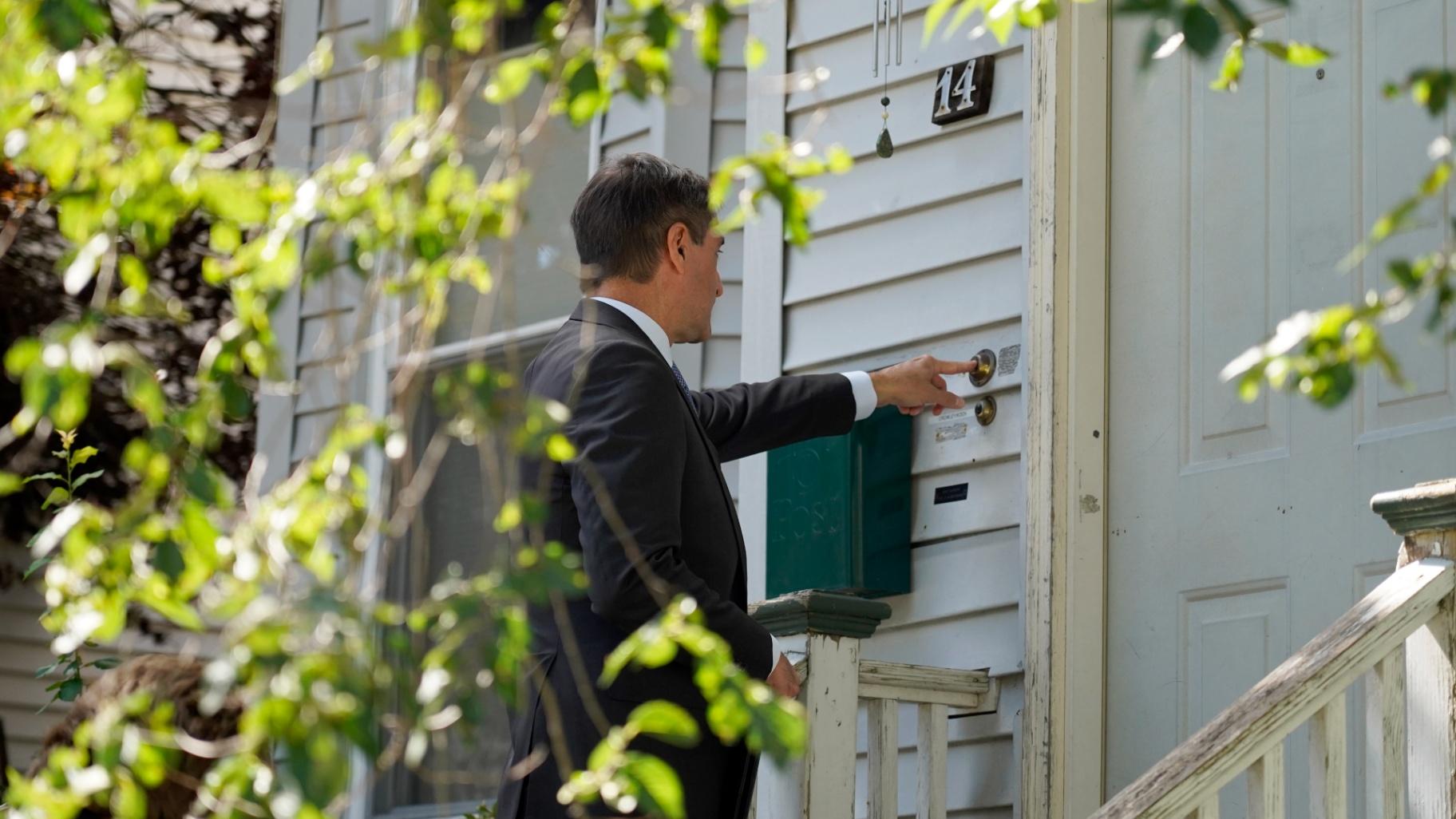 Dan Sideris, of Newton, Mass., rings a doorbell of a home as he and his wife return to door-to-door visits as Jehovah’s Witnesses, Thursday, Sept. 1, 2022, in Boston. (AP Photo / Mary Schwalm)