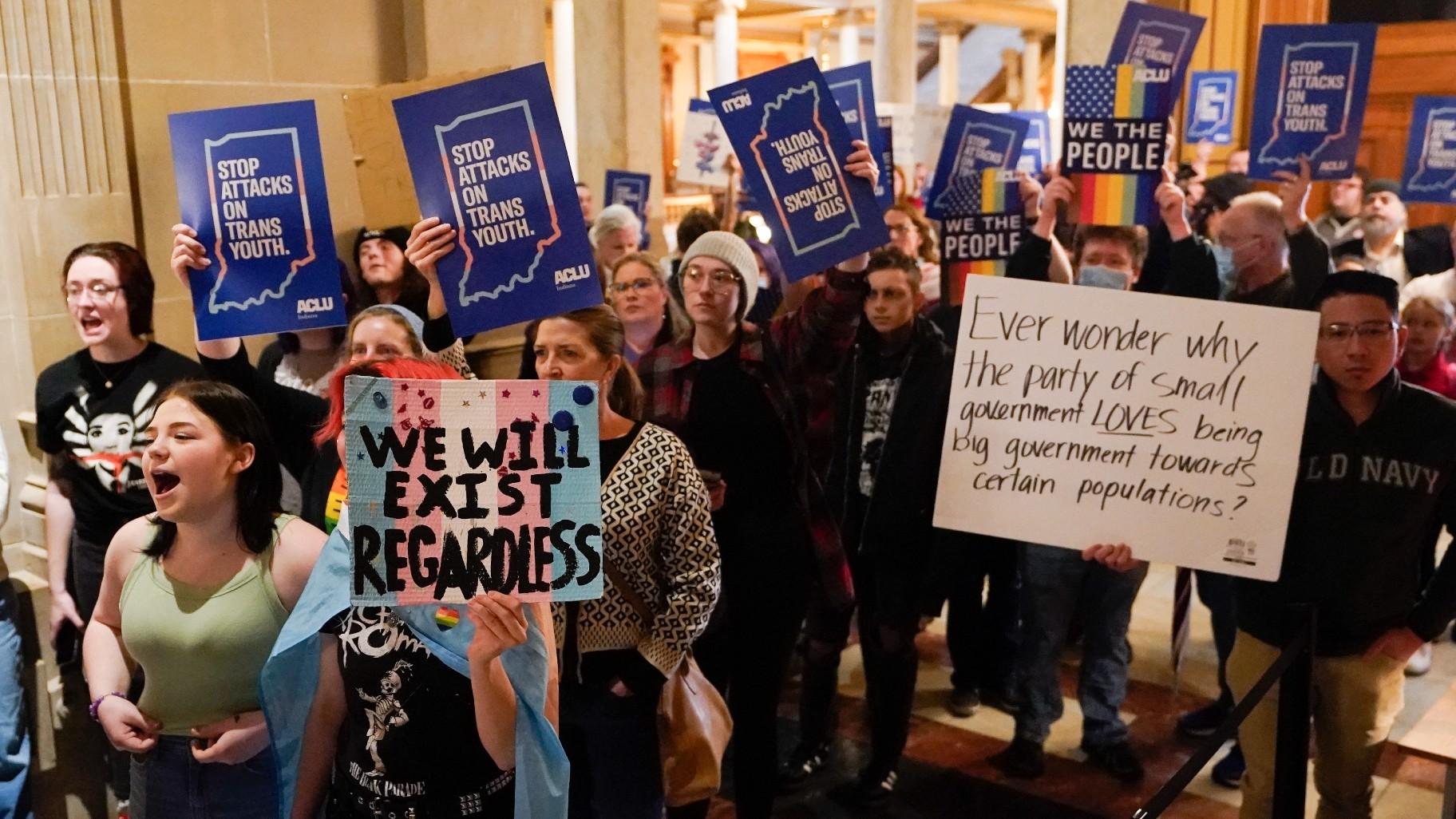 Protesters stand outside of the Senate chamber at the Indiana Statehouse on Feb. 22, 2023, in Indianapolis. (AP Photo / Darron Cummings, File)