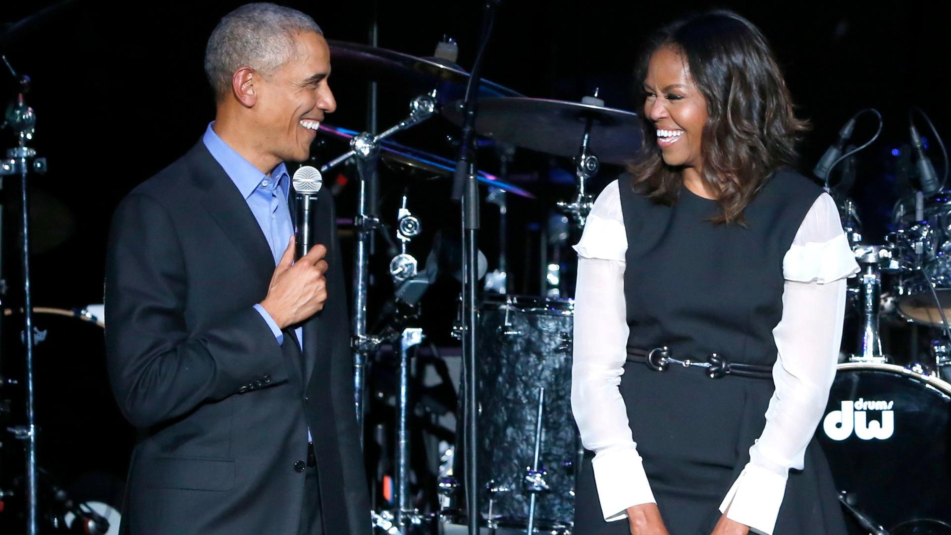 Former President Barack Obama, left, and former first lady Michelle Obama appear on stage during a community concert at the Obama Foundation Summit on Nov. 1, 2017, in Chicago. (AP Photo / Charles Rex Arbogast, file)