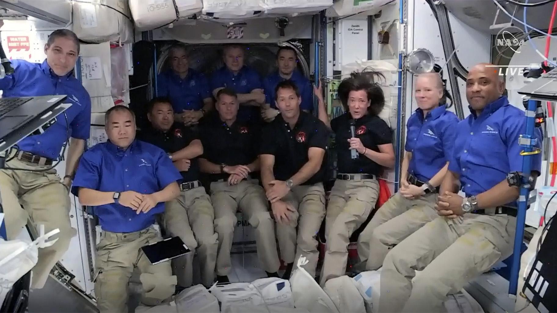 This image provided by NASA, astronauts from SpaceX join the astronauts of the International Space Station for an interview on Saturday, April 24, 2021. A recycled SpaceX capsule carrying four astronauts has arrived at the International Space Station, a day after launching from Florida. The Dragon capsule docked autonomously with the orbiting outpost on Saturday. (NASA via AP)